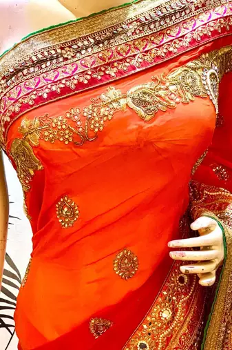Pure georgette wedding wear saree in red & orange with embroidery work & crystal stone work