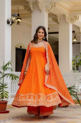 orange color embroidered and mirror work silk blend salwar suit 