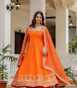 orange color embroidered and mirror work silk blend salwar suit 