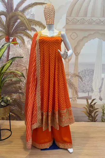 orange color embroidered and mirror work silk blend salwar suit 