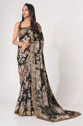 Deep black textured saree features soft beige decorated with gold sequins, floral embroidery printed party wear Saree