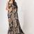 Deep black textured saree features soft beige decorated with gold sequins, floral embroidery printed party wear Saree