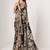 Deep black textured saree features soft beige decorated with gold sequins, floral embroidery printed party wear Saree