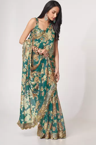 Deep Teal green features antique gold floral prints and Richly covered with gold sequin embroidered saree