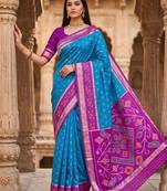 Sky blue color pochampally silk blend ikkat design zari border sarees