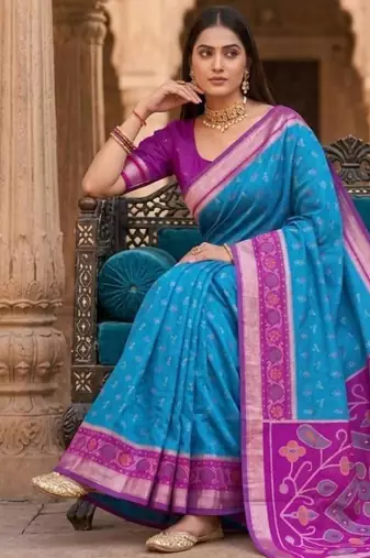 Sky blue color pochampally silk blend ikkat design zari border sarees