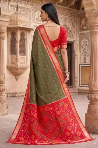 Dark green color pochampally silk blend ikkat design zari border sarees