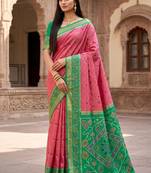 Pink color pochampally silk blend ikkat design zari border sarees