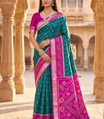 Sea green color pochampally silk blend ikkat design zari border sarees