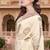 off-white color fendy silk blend foil print with zircon work saree