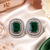 Rhodium green halo stud earrings