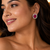 Rose gold ruby halo stud earrings