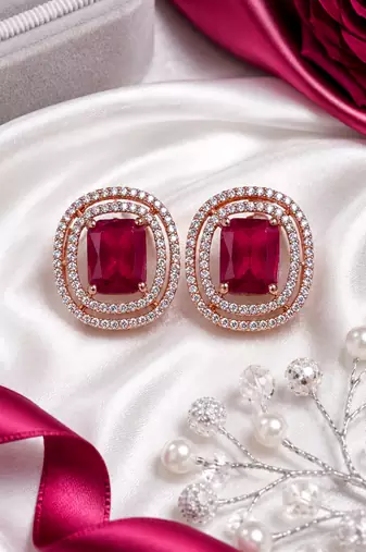 Rose gold ruby halo stud earrings