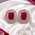Rose gold ruby halo stud earrings