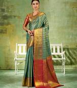 rama green color kanjivaram silk blend woven designer ethnic partywear saree