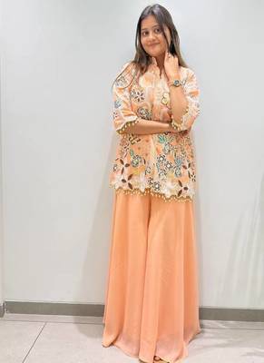 peach color embroidery and sequnce work georgette salwar suit 1