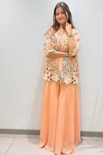 peach color embroidery and sequnce work georgette salwar suit