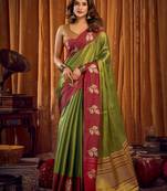 green color smart and ethnic soft tissue woven designer saree