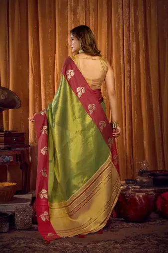 green color smart and ethnic soft tissue woven designer saree