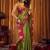 green color smart and ethnic soft tissue woven designer saree