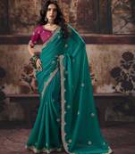 teal color heavy work rich wedding reception bemberg fabric saree