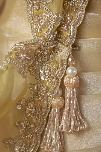 beige color heavy work rich wedding reception satin patta fabric saree