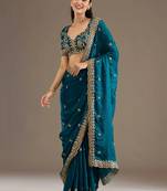 Enchanting blue tissue silk zari and sequins embroidered indian latest design party wear saree