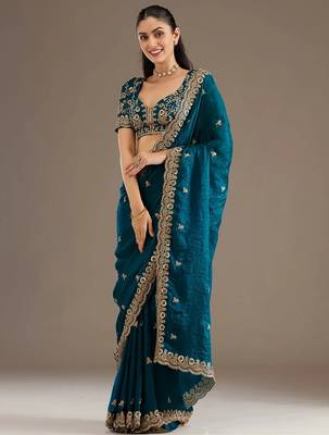 Enchanting blue tissue silk zari and sequins embroidered indian latest design party wear saree 2