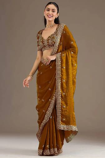 Mesmerizing gold tissue silk zari and sequins embroidered indian latest design wedding sarees