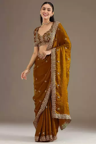 Mesmerizing gold tissue silk zari and sequins embroidered indian latest design wedding sarees