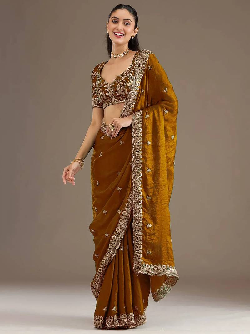 Mesmerizing gold tissue silk zari and sequins embroidered indian latest design wedding sarees