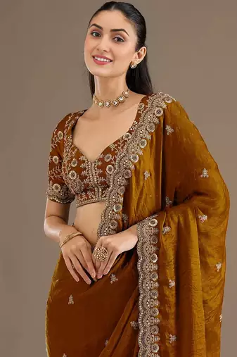 Mesmerizing gold tissue silk zari and sequins embroidered indian latest design wedding sarees