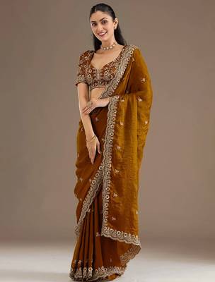 Mesmerizing gold tissue silk zari and sequins embroidered indian latest design wedding sarees 3