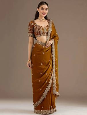 Mesmerizing gold tissue silk zari and sequins embroidered indian latest design wedding sarees 4