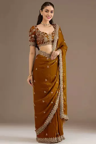 Mesmerizing gold tissue silk zari and sequins embroidered indian latest design wedding sarees