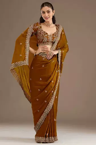 Mesmerizing gold tissue silk zari and sequins embroidered indian latest design wedding sarees
