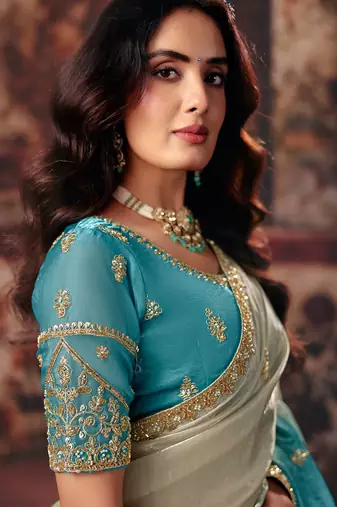 Aqua blue fendy satin handwork motif work crystal beads work saree with blouse
