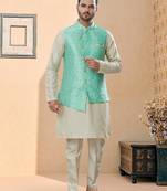 Firozi colour heavy banarasi jacquard jacket kurta pajama set with fancy buttons.