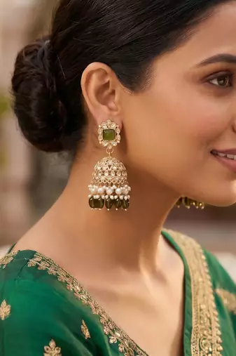 Rose gold plated light green  stone  studded dome jhumka earrings with pearls