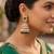 Rose gold plated light green  stone  studded dome jhumka earrings with pearls