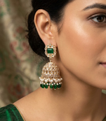 Rose gold plated green stone  studded dome jhumka earrings with pearls