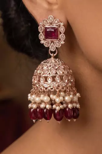Rose gold plated  ruby stone  studded dome jhumka earrings with pearls