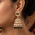 Rose gold plated light green  stone  studded dome jhumka earrings with pearls