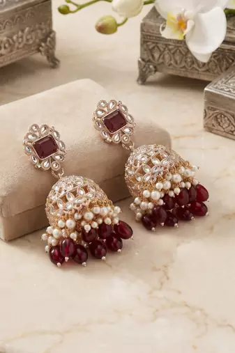 Rose gold plated  ruby stone  studded dome jhumka earrings with pearls