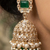 Rose gold plated green stone  studded dome jhumka earrings with pearls