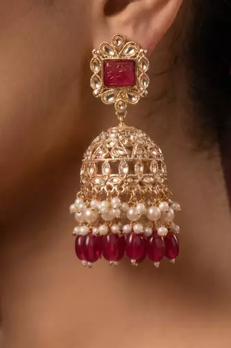 Rose gold plated maroon  stone  studded dome jhumka earrings with pearls