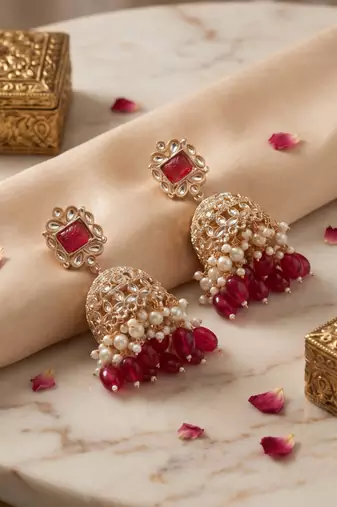 Rose gold plated maroon  stone  studded dome jhumka earrings with pearls