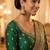 Rose gold plated light green  stone  studded dome jhumka earrings with pearls