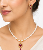 Pearl strand necklace and earring set with ruby pendant gold-tone setting, oval ruby centerpiece, drop earrings included