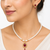 Pearl strand necklace and earring set with ruby pendant gold-tone setting, oval ruby centerpiece, drop earrings included